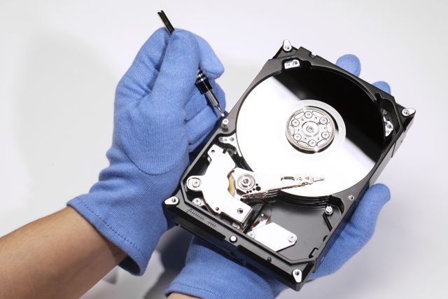 high-angle-hands-repairing-hard-drive-2.jpg